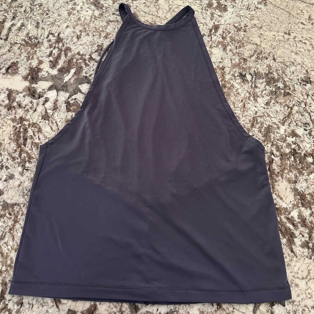 Dark woman’s tank top with open back.